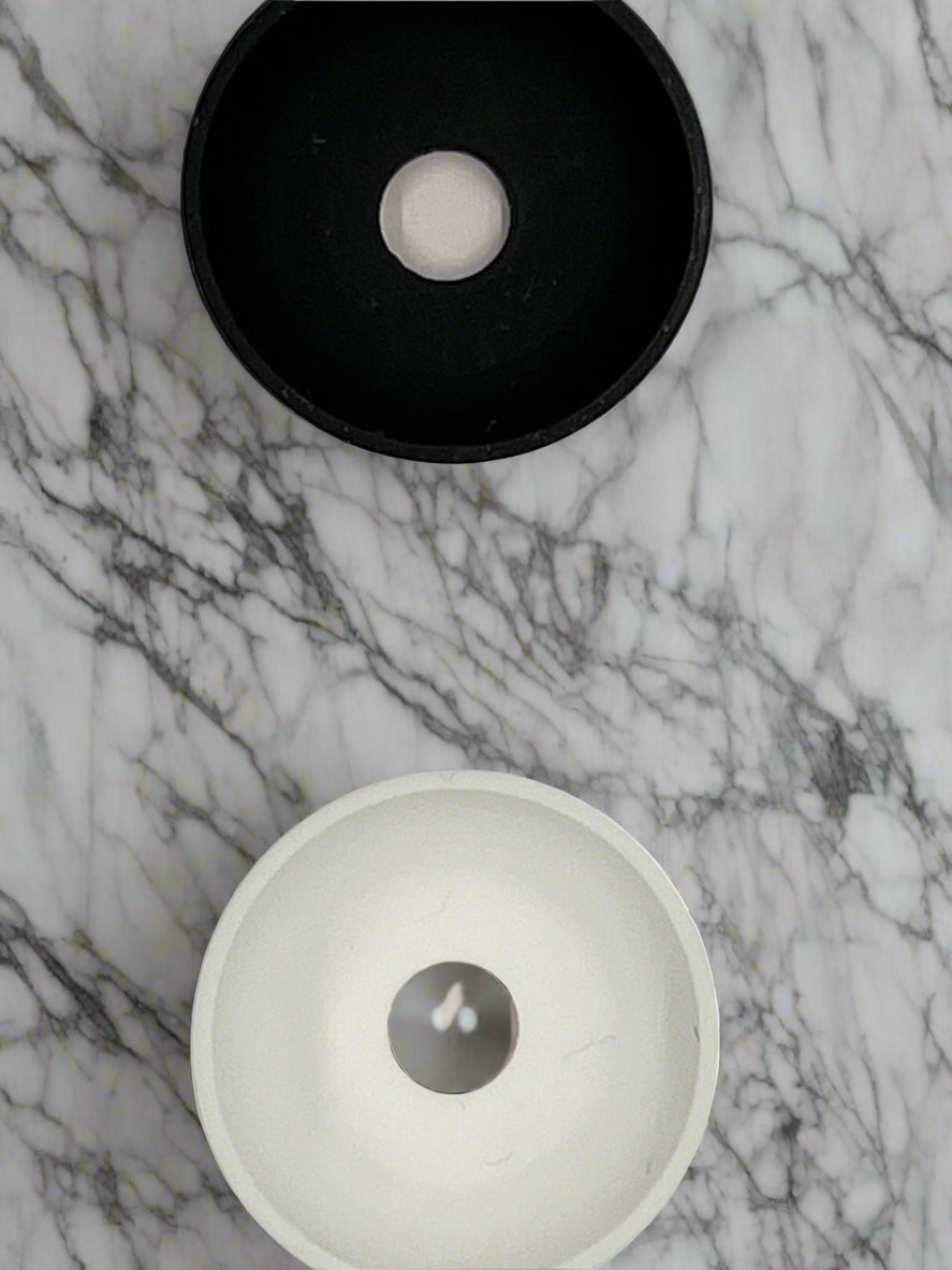 Black and White Drip Dodger. They come two in a pack, one of each color. Keep electric toothbrush base clean and hands while brushing
