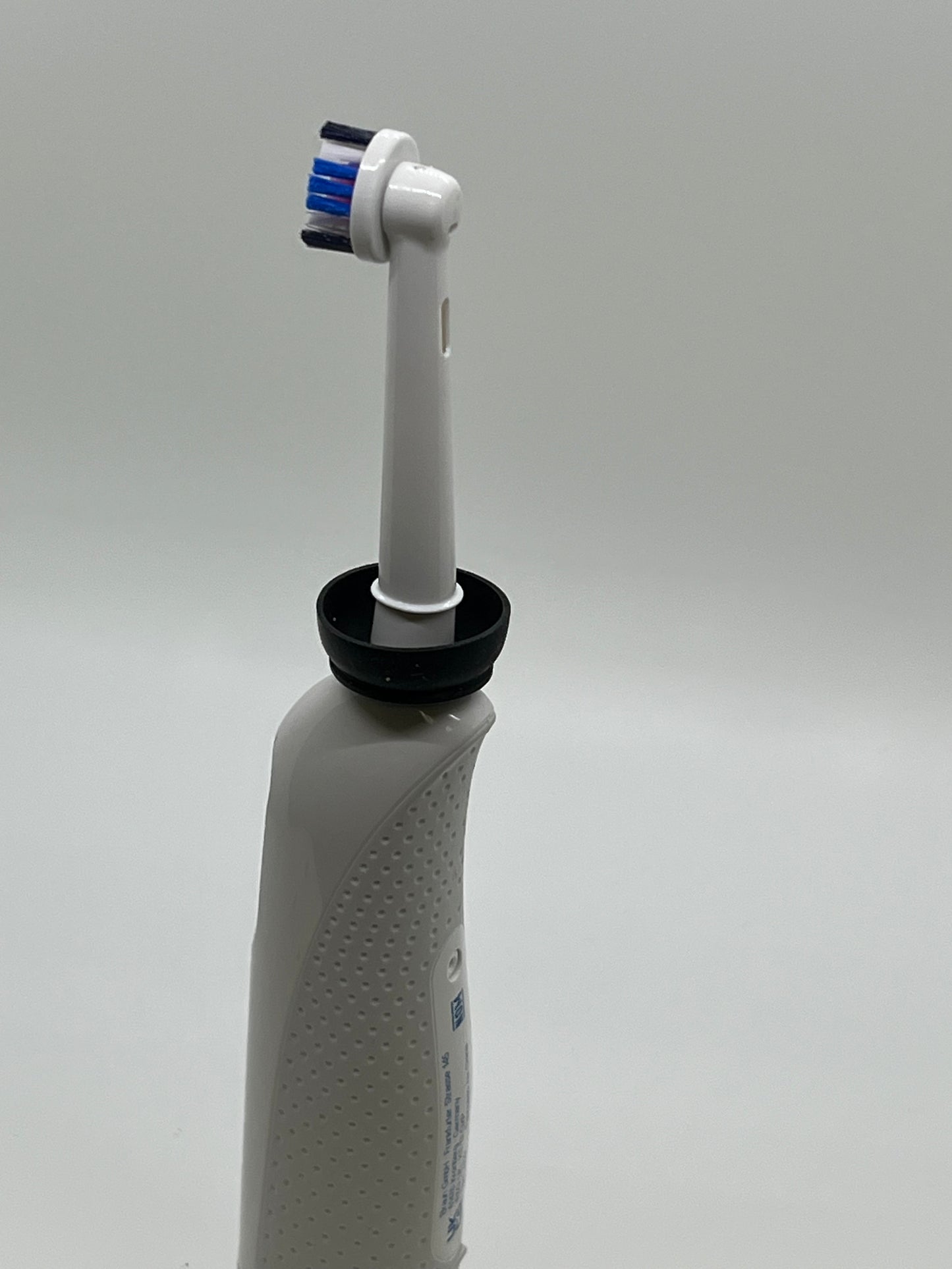 The Drip Dodger by Koettco International. No More Mess!! Keep hands and base of electric toothbrushes clean of residues (Paste, Slop, Drips, Spit, Muck, Yuck.) Black and White.